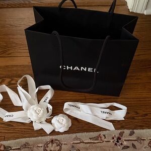 CHANEL Black shopping Bag with White Floral Ribbons